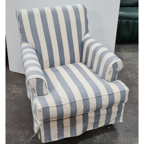 497 - Lovely blue and white stripey chair. Looks new there is a vey small less than an inch tear in the ba... 