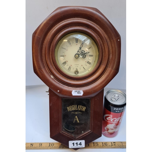 114 - 31 day regualator neat size wall clock with a thick mahogany case.