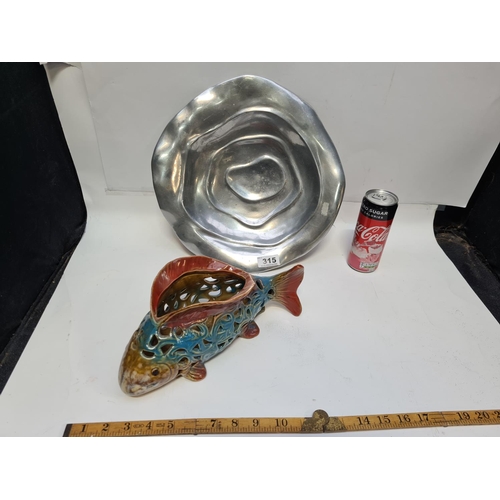 315 - Glazed pottery fish and a heavy pewter bowl.