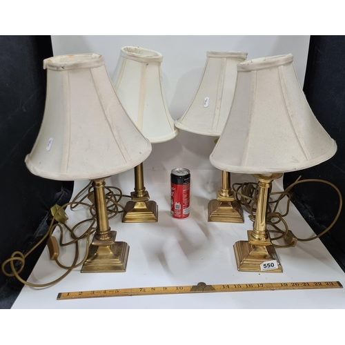 550 - Four heavy brass table lights and shades.