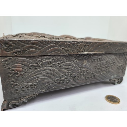 304 - Antique bronze Chinese box with fish in relief.