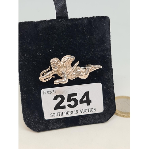 254 - Heavy old silver cupid brooch