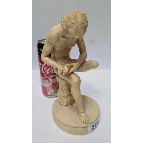 273 - Statue of a man picking his feet.