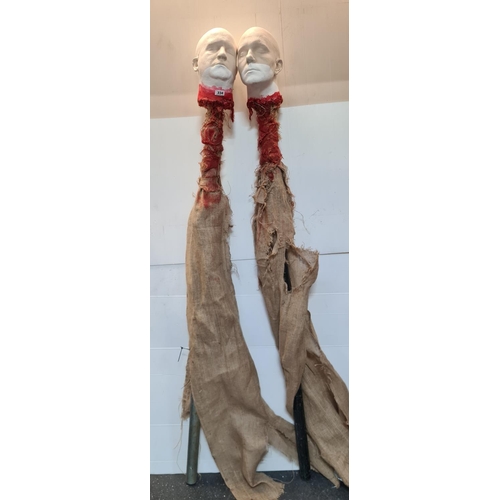 334 - Super pair of faux commercial quality severed heads on tall metal poles about 7 feet tall. From a di... 