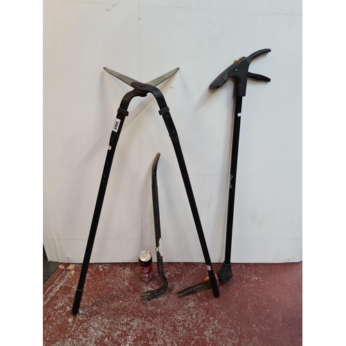 85 - Three tools, Pruner, Edger and crow bar.