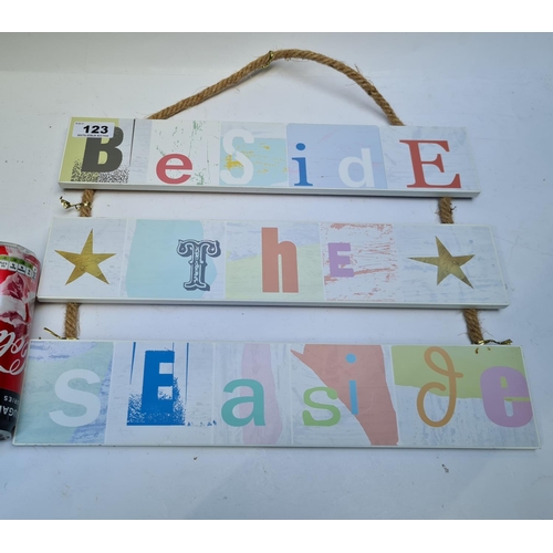 123 - A fun 'Beside the Seaside' sign, hung with manilla-type rope.