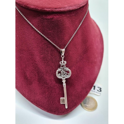 13 - Antique sterling silver large key and silver chain.