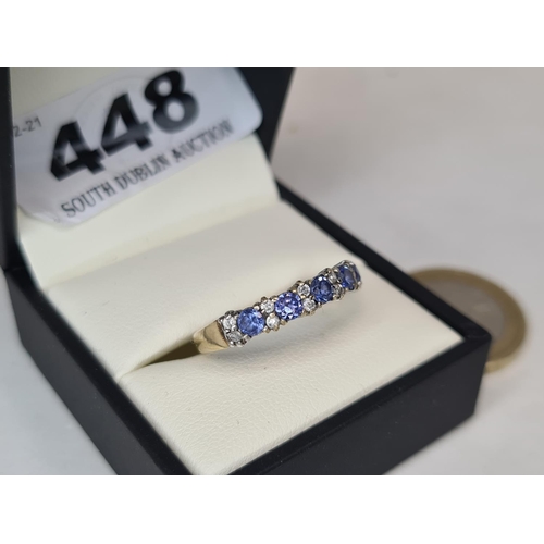 448 - Very pretty 9ct gold tanzanite half eternity ring. Size O 1/2