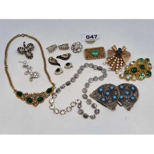 47 - Very good selection of heavily jewelled vintage costume jewellery. Including large brooches, earring... 