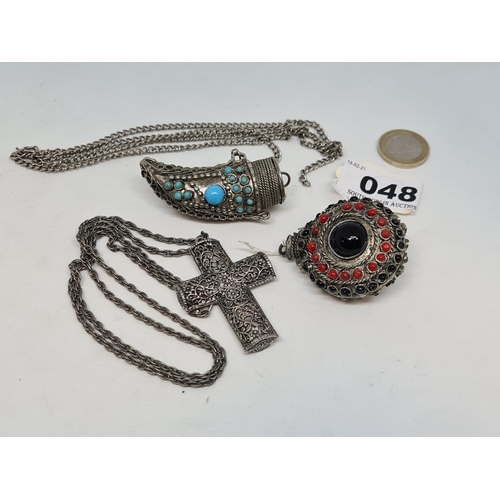 48 - Three very interesting vintage pieces. Including a large filigree cross and chain and two Eastern sn... 