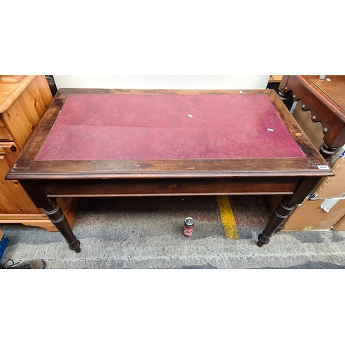 488 - This is a very nice Victorian writing desk with a leatherette top and turned legs.