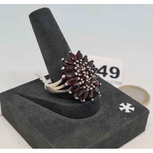 49 - Super impressive sterling silver ring with cranberry red stones. Heavy good quality.