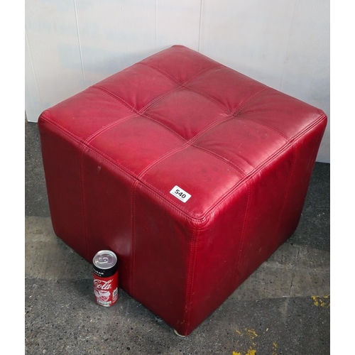 540 - Red leather footstool.