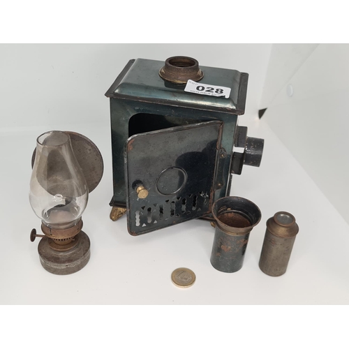 28 - Green magic lantern projector with glass funnel and brass burner. This has a quantity of coloured sl... 