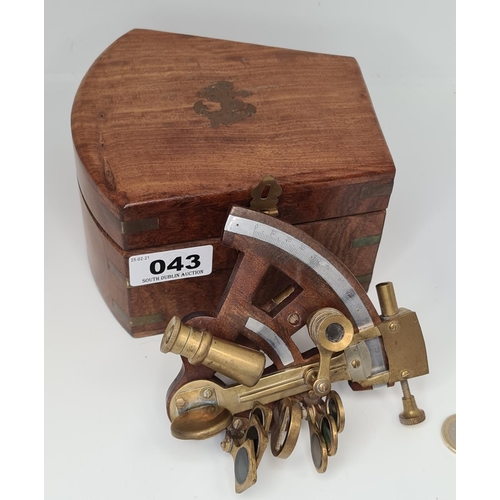 43 - Ships sextant in a brass bound wooden box.