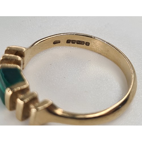 30 - Unusual 9ct gold ring with a green malachite stone. almost 3g.