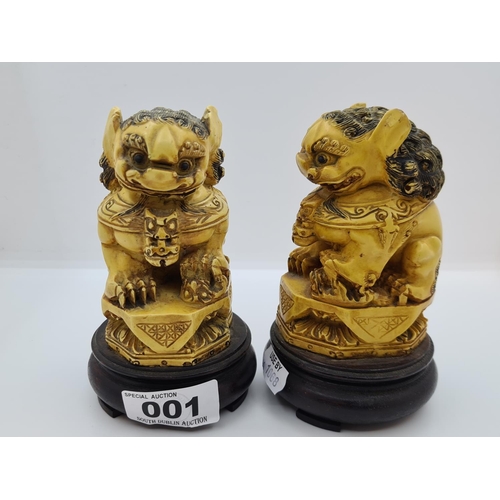 1 - Pair of 19th century ivory temple dogs on wooden bases.