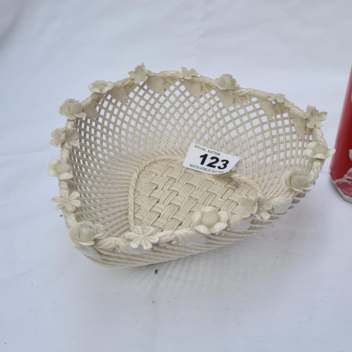 123 - Irish Belleek 19th Century heart shaped basket weave basket. In good order with minor petal loss.