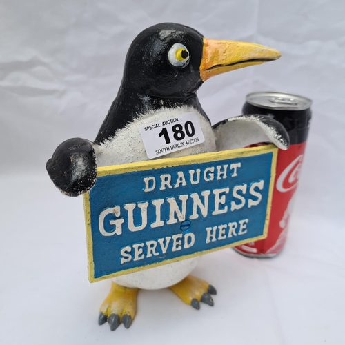 180 - Cast metal Guinness penguin money box.