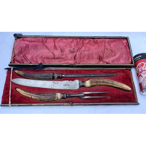 216 - Bone handled, three piece carving set in the original red velvet presentaton box