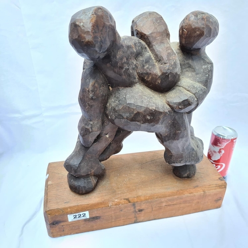 222 - Carved wooden sculpture of human forms intertwined. There are no markings on the piece and it may be... 