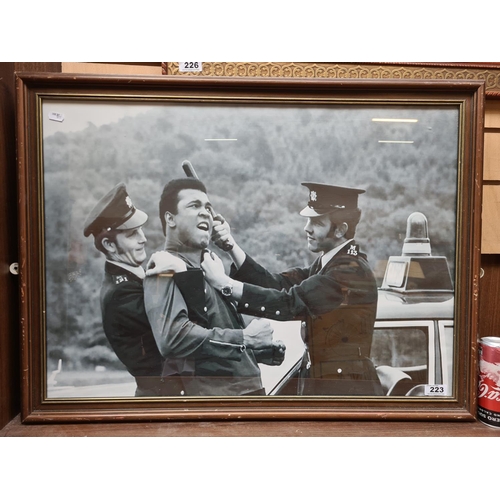 223 - Large framed poster of the iconic image of Ali being hit (!) by the Garda.