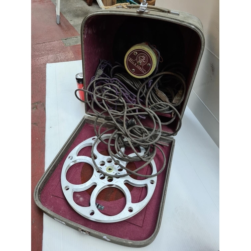 229 - Bell & Howell projector reel and speaker, with matching case