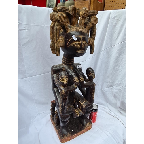 327 - Rare wooden African statue. Stands 77cm tall. Possibly from the Yoruba tribe. No markings but very i... 