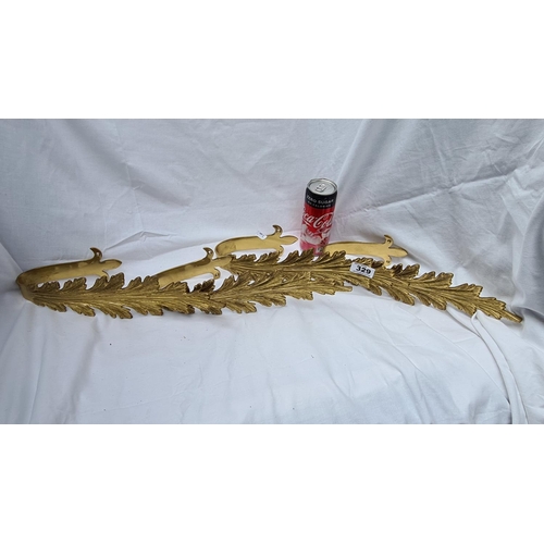 329 - Set of four brass, decorative feather-shaped wall brace.