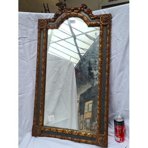 53 - Antique Teal and gilt framed mirror with beautiful detailing. New York gallery label on the back.