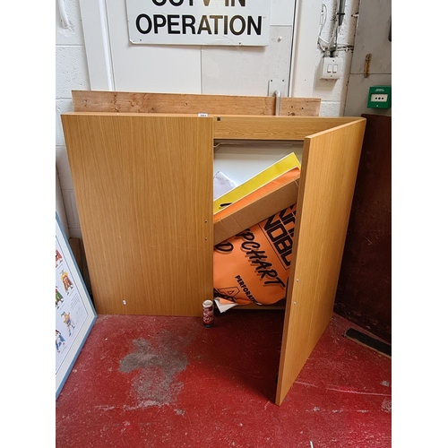 82 - Large Beechwood Office cabinet, holding a large dry erase white board, pull down screen and a foldin... 