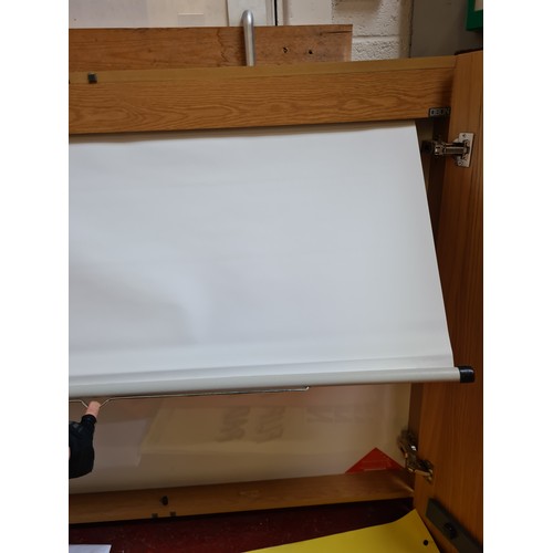 82 - Large Beechwood Office cabinet, holding a large dry erase white board, pull down screen and a foldin... 