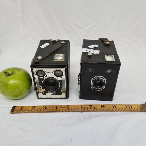 372 - Pair cameras. Including a Brownie SLX-20, Model C camera and a six-20 Hawkeye camera.