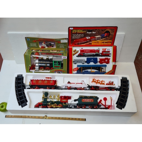 373 - Three model trains. A battery operated 'Old Smokey' train set, including rail. A Western Express and... 