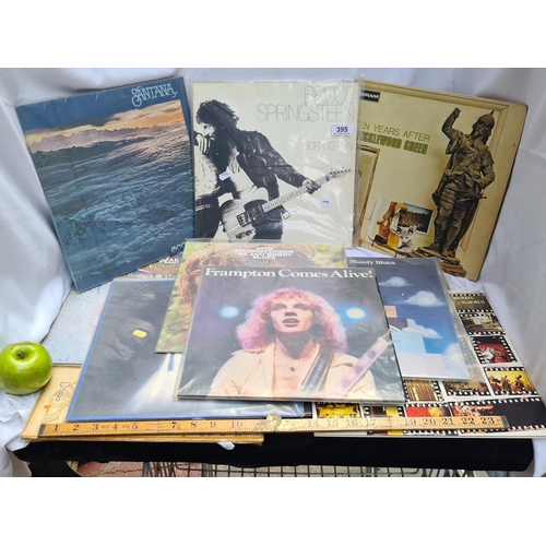 395 - Selection of 11 vinyls. Includes Bruce Springsteen, Santana, Frampton etc Good lot