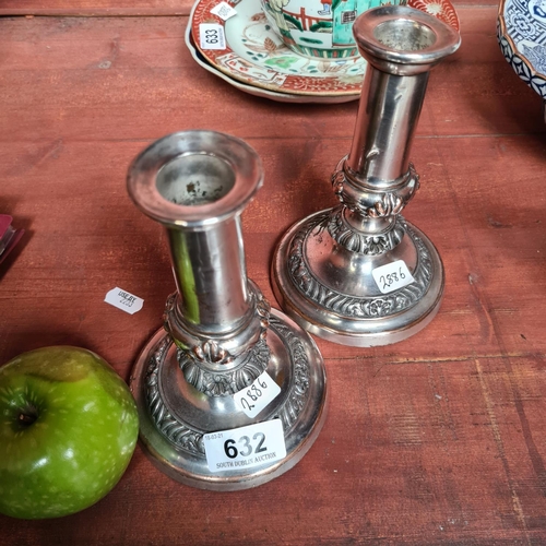 632 - Pair of silver plated candlesticks.