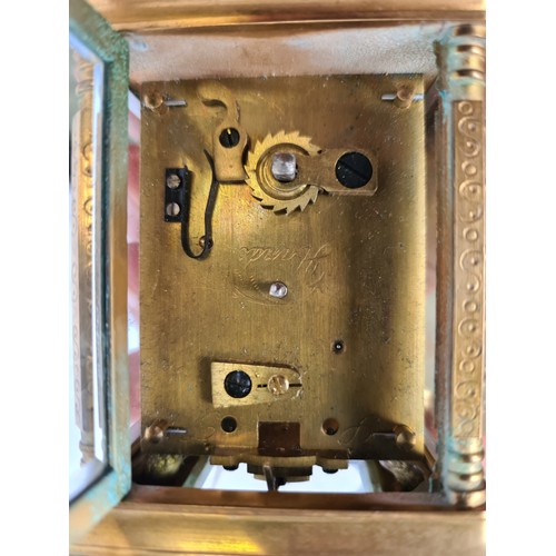 69 - Elliot & son, miniature  carriage clock. With incised floral detail and glass sides to see the mecha... 