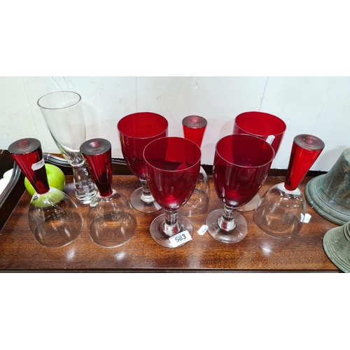 583 - Set of nine red and clear vintage glasses.