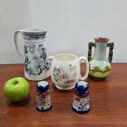 597 - Five pieces of pottery inc two jugs, salt and pepper and a twin handled jug.