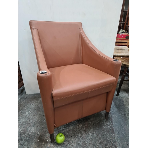 606 - Handsome genuine leather armchair.