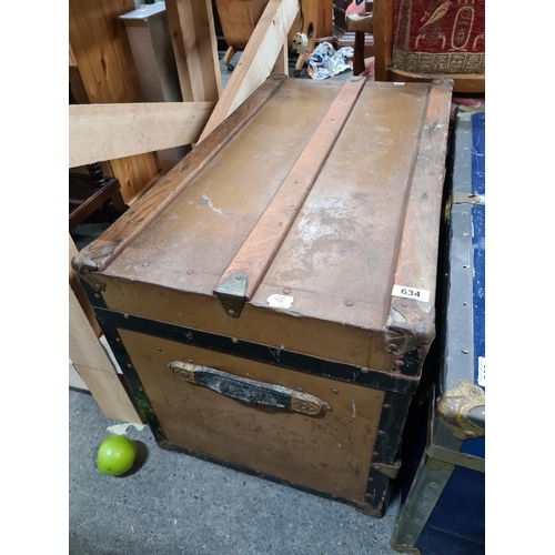 634 - Large antique trunk with wooden banding and Iron hardware. Nice example.