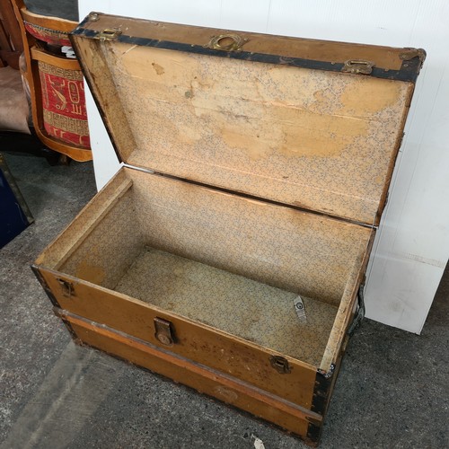 634 - Large antique trunk with wooden banding and Iron hardware. Nice example.