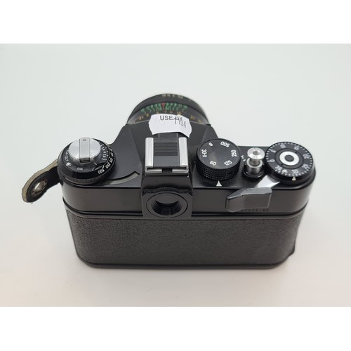 413 - Zenit 11 35 mm SLR camera. With a 20-60 lens. Good order