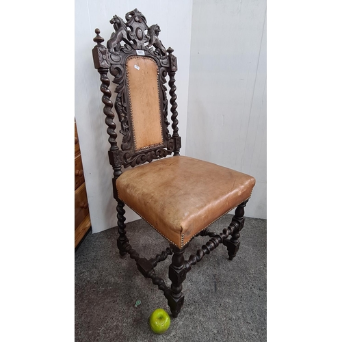 669 - Antique barley twist throne chair with tan leather upholstery and beautiful handcrafted back.