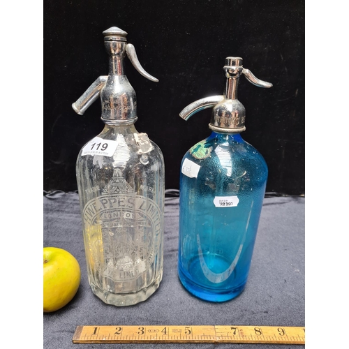 119 - Two vintage soda siphons, one Schweppes London, one William Brookes, Brooklyn, NY, in blue glass.