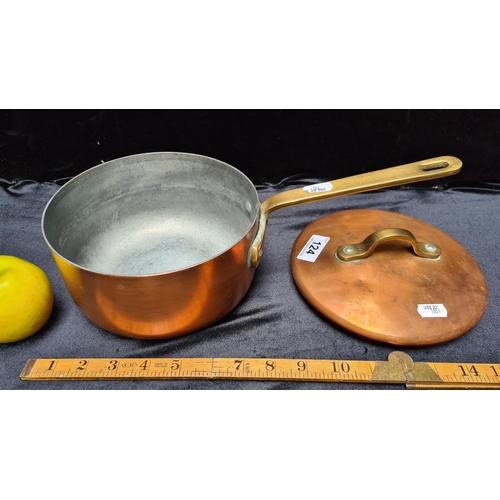 124 - Lidded copper and brass handled saucepan stamped 'Castle Copper', made in Ireland. 7 inch diameter. ... 