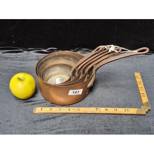 141 - Collection of five copper and iron handled saucepans. Antique heavy Super quality.