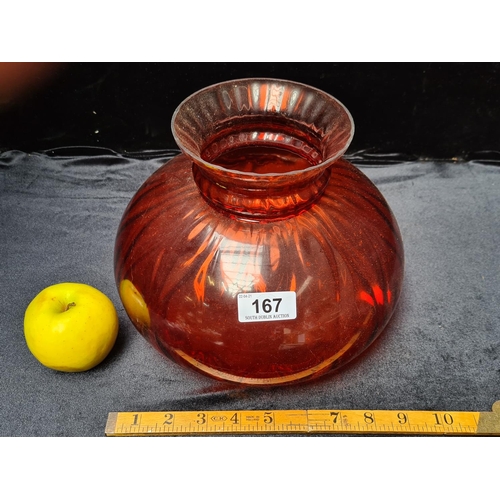 167 - Cranberry coloured glass oil lampshade. Approx 7 inch diameter countersunk base.