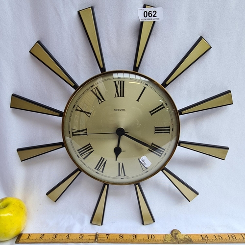 62 - Retro style battery clock (sunburst).  diameter 17 inches.