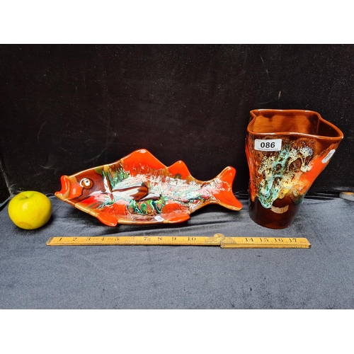 86 - Two pieces of Vallarius lava ware, vase 8 inches (h) and fish dish 14 inches (l).